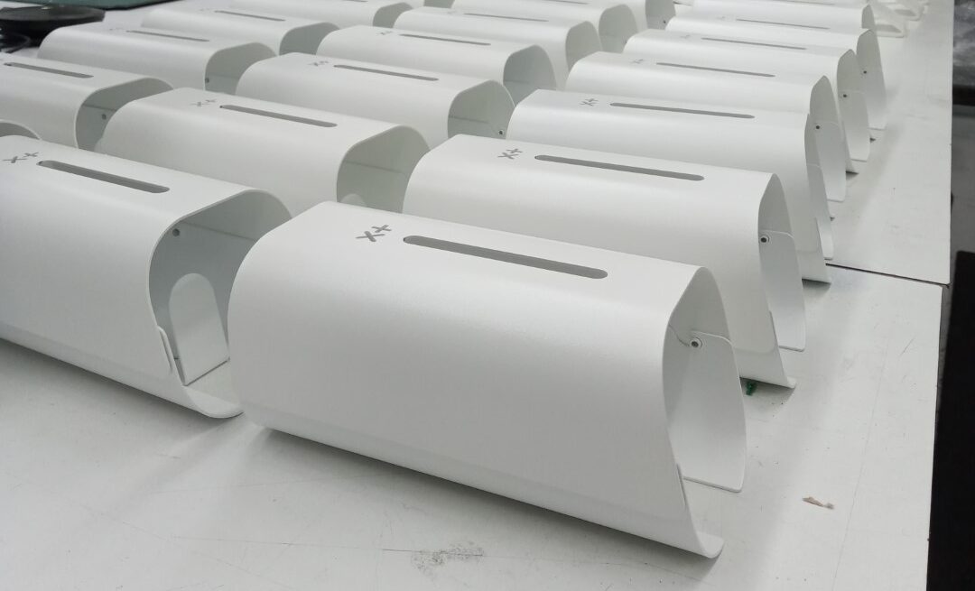 Multiple white hand sanitiser stations on white bench during manufacturing in Melbourne